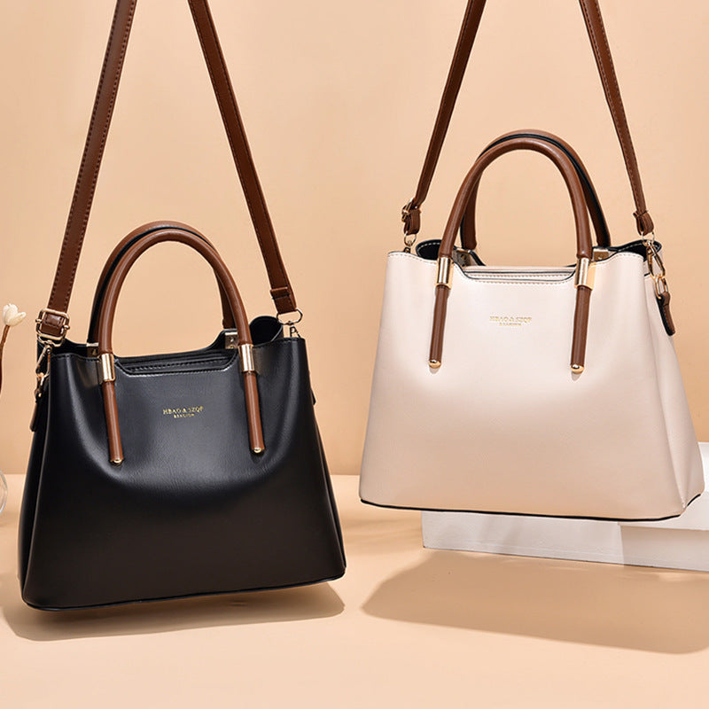 Versatile-black-barrel-shaped-crossbody-bag