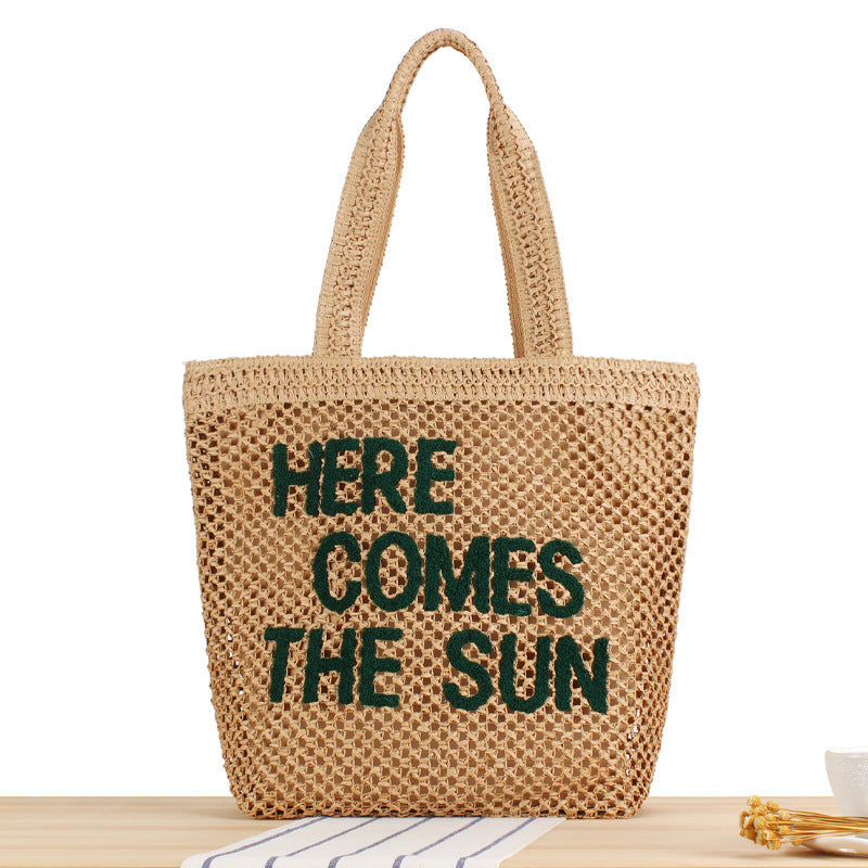 Fashionable-letter-accents-on-straw-shoulder-bag