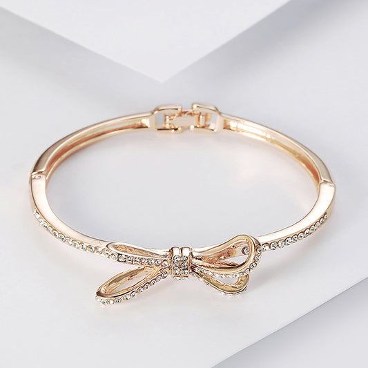 rose-gold-alloy-bracelet-diamond-accents-elegant-bow-detail