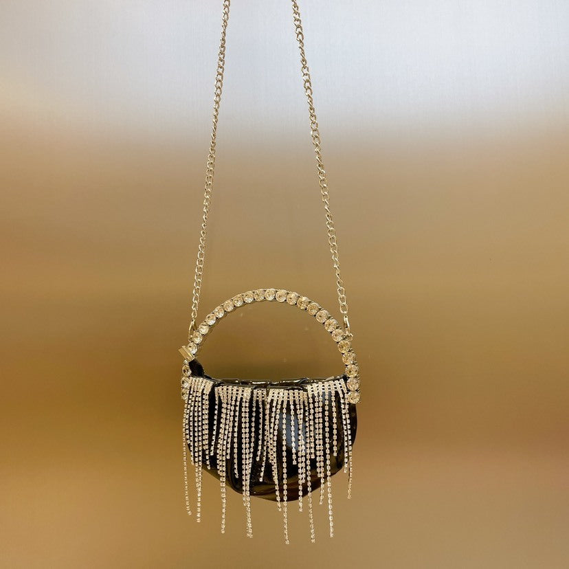 Glittering-evening-handbag-with-rhinestones-pleats-and-tassel-detail